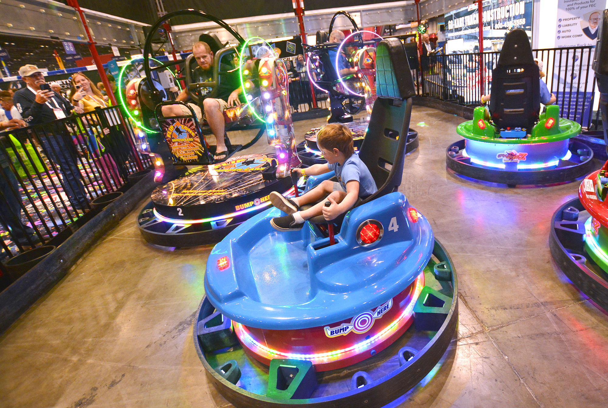 Riders test out bumper cars that spin and flip.